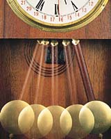 This pendulum clock keeps time as the pendulum swings back and forth. ( Robert Mathena/ Fundamental Photographs)
