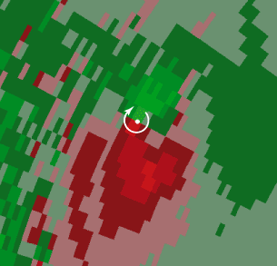 This color-enhanced NEXRAD view of a tornado shows winds moving toward (green) and away from (red) a NEXRAD station, which is below and to the right of the figure. The white dot and arrow indicate the the storm center and direction of wind circulation. (Courtesy Kurt Hondl, National Severe Storms Laboratory, Norman, OK.)
