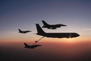 Midair refueling offers an interesting example of relative velocity. To refuel, the lower plane matches its velocity to that of the tanker (the larger aircraft) and couples to the tankers delivery tube. During refueling, the relative velocity of the two planes is zero. ( George Hall/Corbis Images)